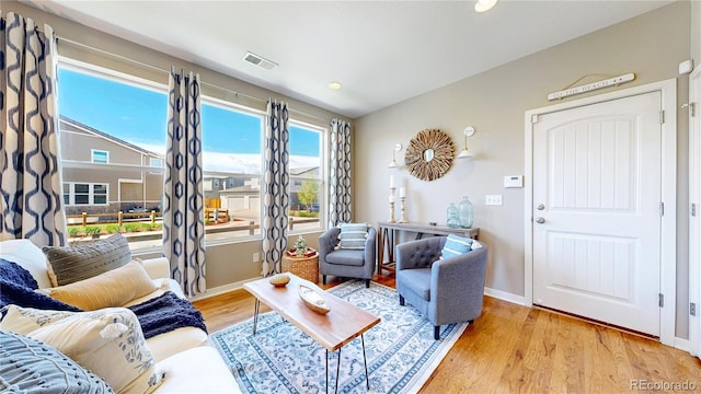 10016 Hough Pt, Parker, CO 80134 - living room with wood finished floors, baseboards, and recessed lighting