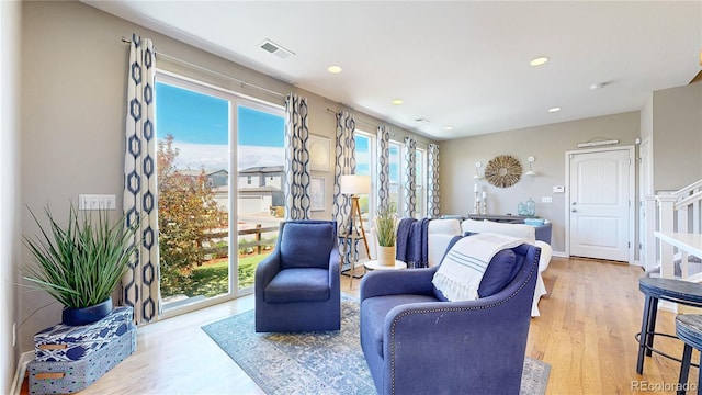 10016 Hough Pt, Parker, CO 80134 - living area with wood finished floors, recessed lighting, and stairs