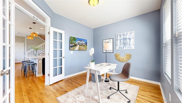 10016 Hough Pt, Parker, CO 80134 - home office with french doors, light wood-type flooring, and baseboards