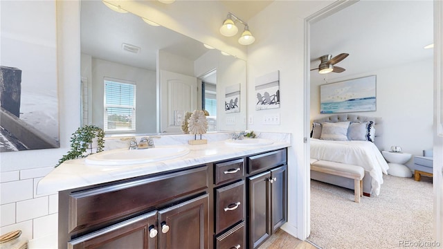 10016 Hough Pt, Parker, CO 80134 - bathroom featuring connected bathroom, double vanity, and ceiling fan