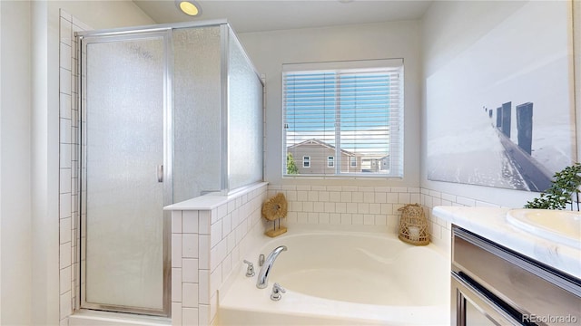 10016 Hough Pt, Parker, CO 80134 - full bath with a bath, a shower stall, and vanity