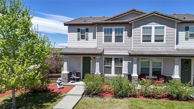 10016 Hough Pt, Parker, CO 80134 - view of front of house featuring a porch and a front lawn