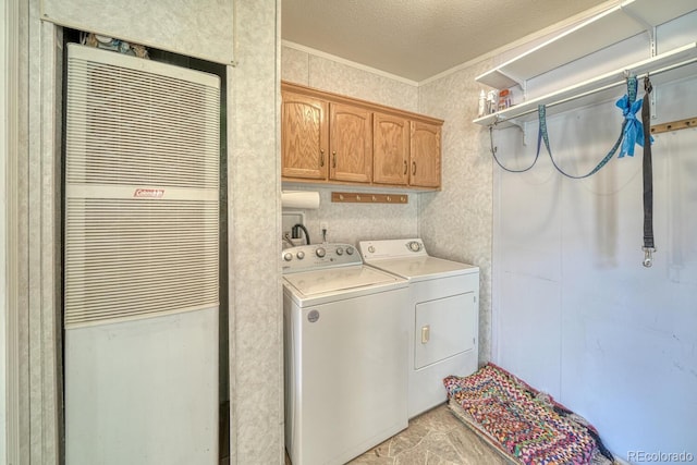 320 Hudson St, Silver Cliff, CO 81252 - laundry room with a heating unit, washer and clothes dryer, crown molding, and cabinet space
