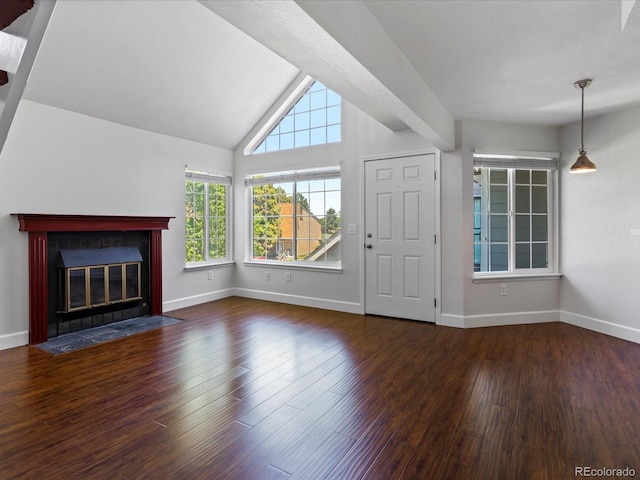 12403 E Tennessee Cir Unit E, Aurora, CO 80012 - unfurnished living room featuring healthy amount of natural light, wood finished floors, a fireplace with flush hearth, and lofted ceiling