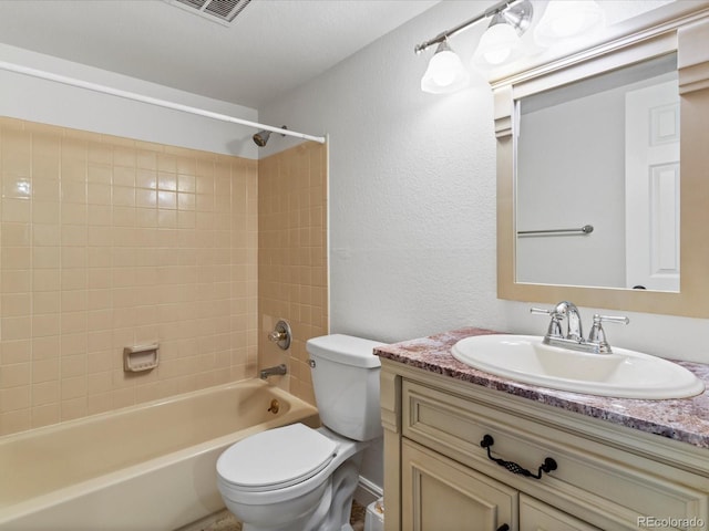 12403 E Tennessee Cir Unit E, Aurora, CO 80012 - bathroom featuring vanity, washtub / shower combination, and a textured wall