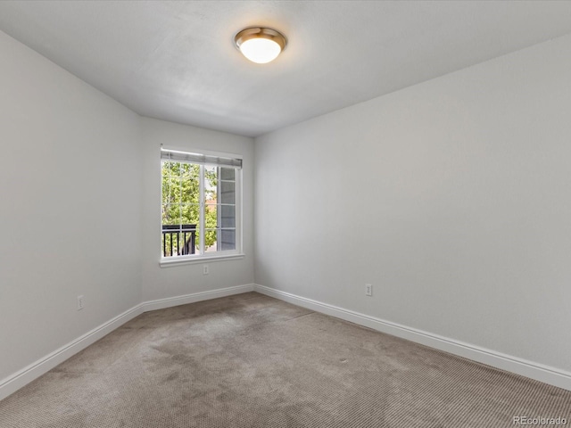 12403 E Tennessee Cir Unit E, Aurora, CO 80012 - carpeted spare room with baseboards