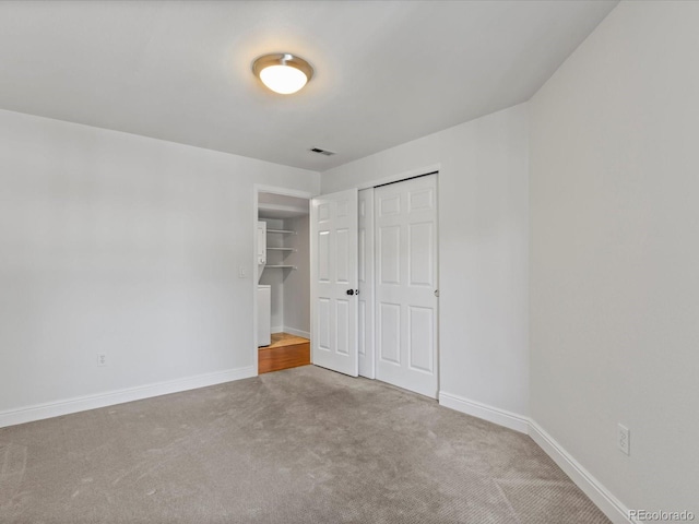 12403 E Tennessee Cir Unit E, Aurora, CO 80012 - unfurnished bedroom with carpet floors and a closet