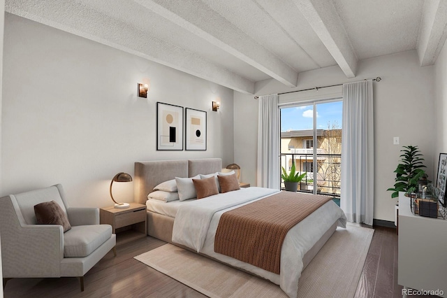 bedroom with wood finished floors, baseboards, beamed ceiling, a textured ceiling, and access to outside