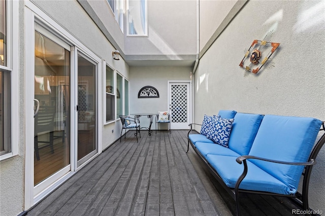 wooden terrace featuring an outdoor living space