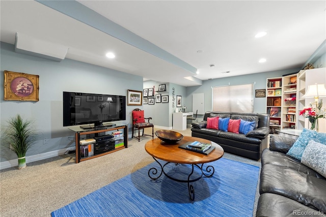 carpeted living area with recessed lighting and baseboards