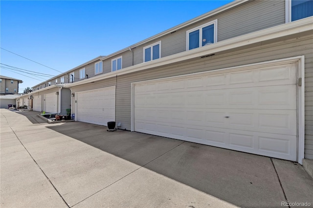 garage with concrete driveway