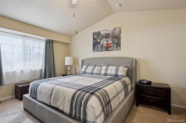 bedroom featuring light colored carpet and vaulted ceiling