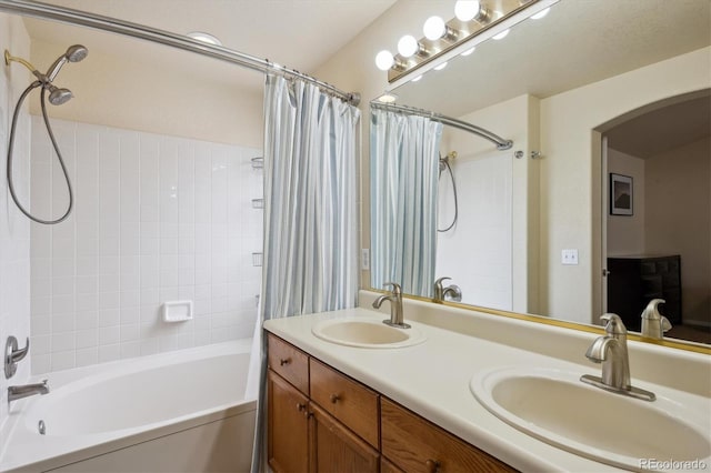 bathroom featuring vanity and shower / tub combo