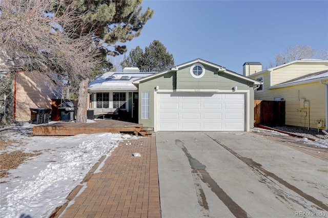 ranch-style home featuring a garage