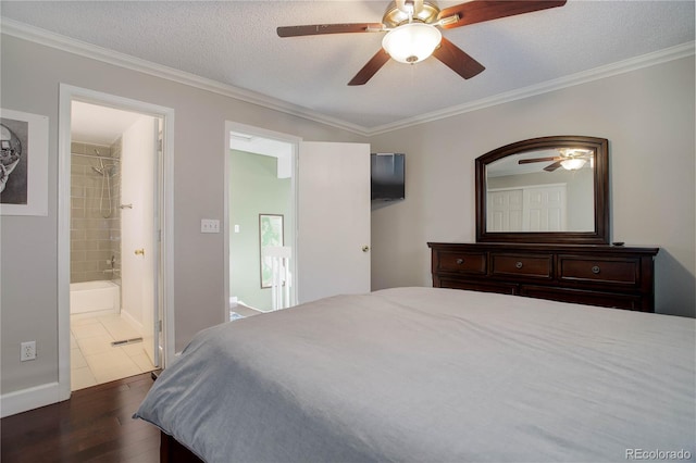 bedroom with dark hardwood / wood-style flooring, ceiling fan, ornamental molding, and a textured ceiling