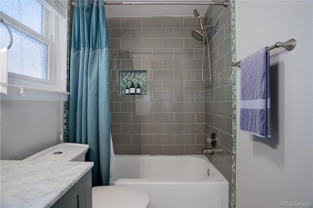 full bathroom with shower / bathtub combination with curtain, vanity, and toilet