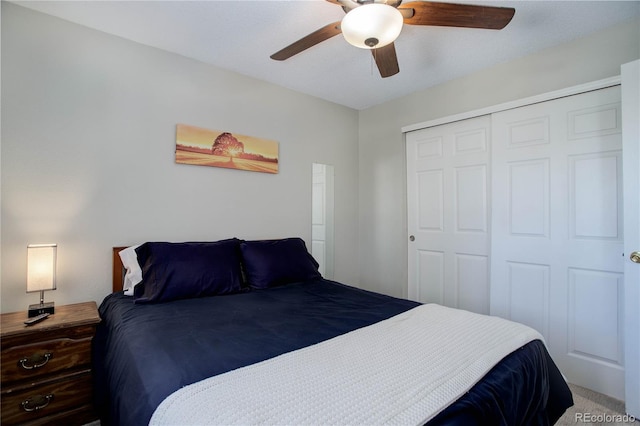 bedroom with ceiling fan and a closet