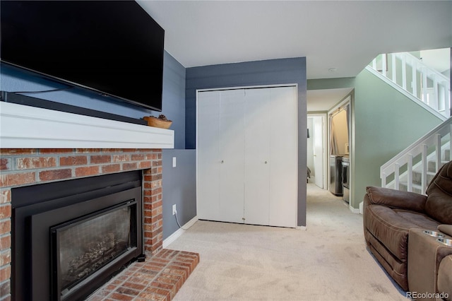 carpeted living room with a brick fireplace