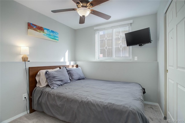 carpeted bedroom featuring ceiling fan