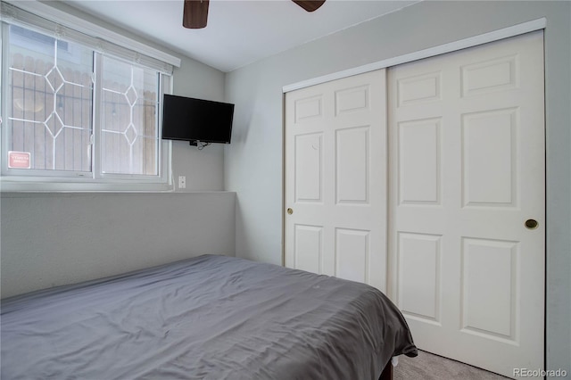 bedroom featuring ceiling fan and a closet