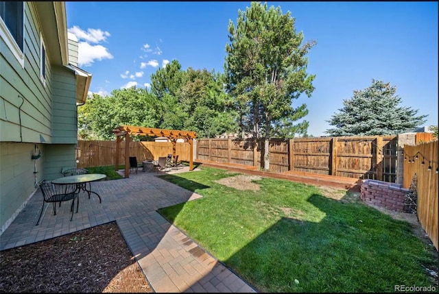 view of yard with a pergola and a patio