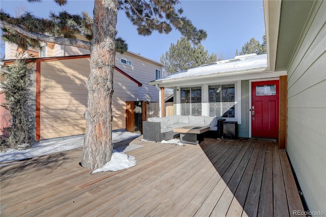 wooden terrace with fence and an outdoor hangout area