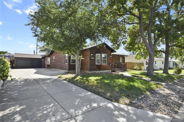 single story home featuring a garage and a front lawn