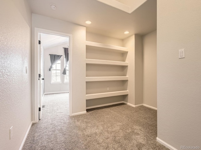 corridor with carpet flooring