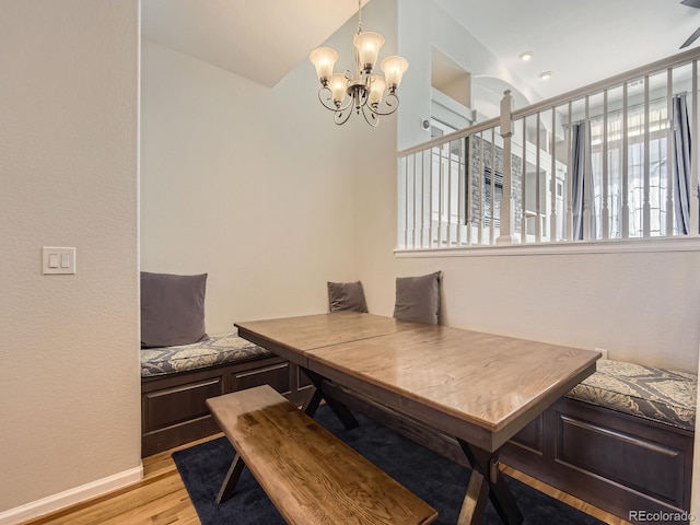 dining area featuring breakfast area, a chandelier, and light hardwood / wood-style flooring