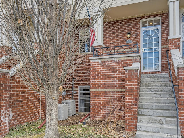 view of side of home with central AC