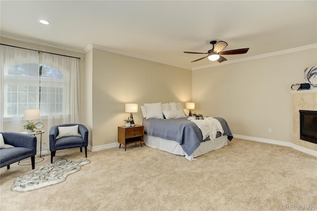 bedroom with baseboards, carpet, a fireplace, and crown molding