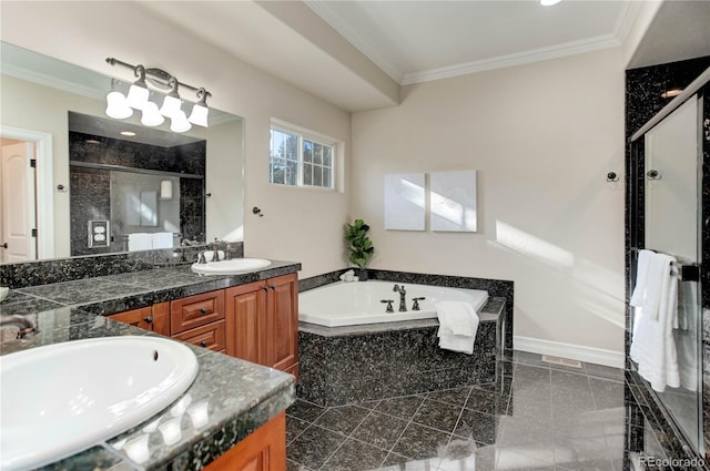 bathroom featuring a shower stall, a sink, a garden tub, and crown molding