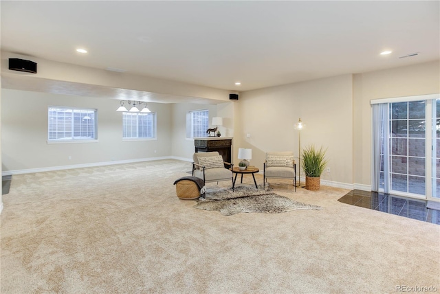 living area with carpet floors, recessed lighting, and baseboards