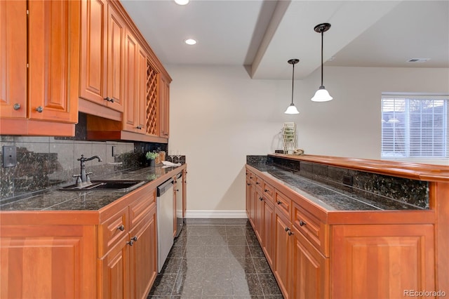 kitchen featuring tile counters, baseboards, granite finish floor, a sink, and recessed lighting