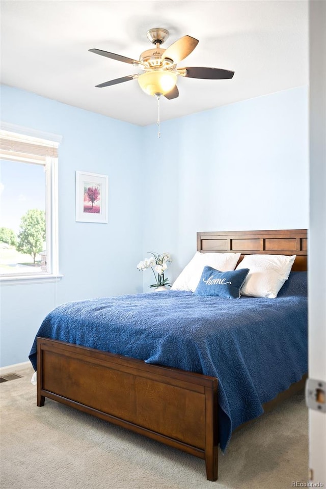 carpeted bedroom featuring ceiling fan