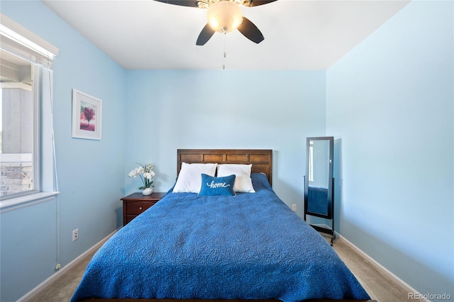 bedroom with ceiling fan and carpet floors