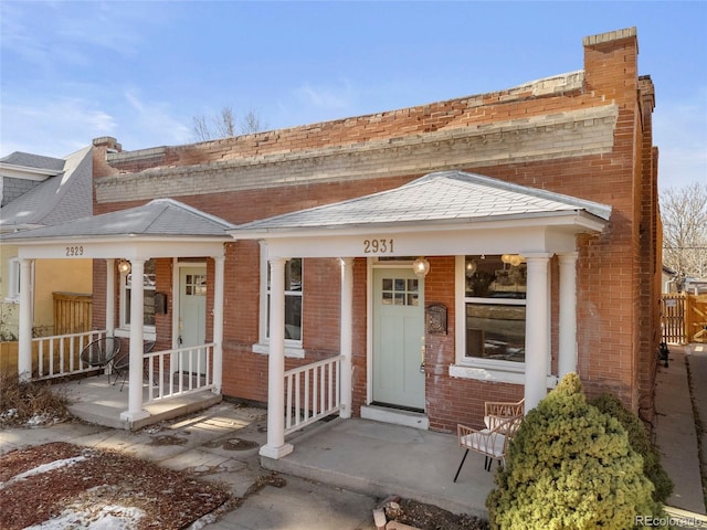 entrance to property featuring a porch