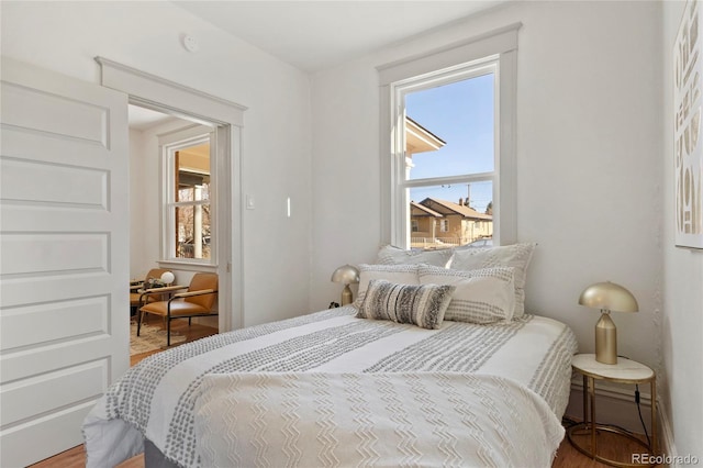 bedroom with hardwood / wood-style floors