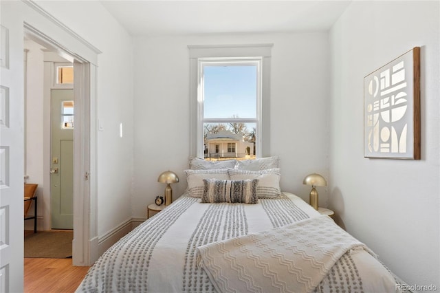 bedroom with wood-type flooring