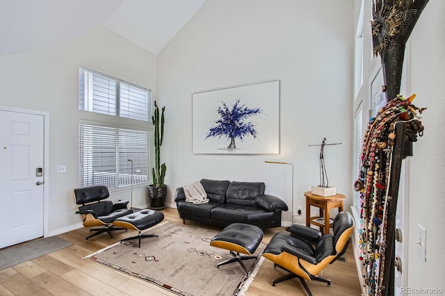 3228 47th, Boulder, CO 80301 - living area with high vaulted ceiling, wood finished floors, and baseboards