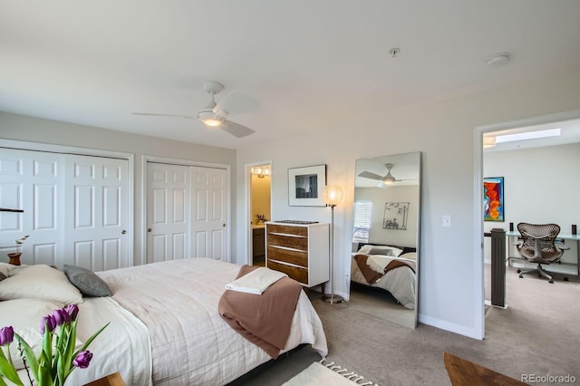 3228 47th, Boulder, CO 80301 - carpeted bedroom featuring multiple closets, baseboards, and a ceiling fan