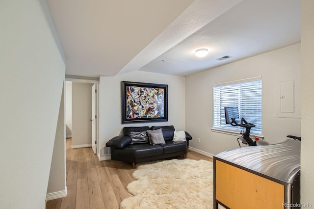 3228 47th, Boulder, CO 80301 - living area featuring baseboards, light wood finished floors, and electric panel