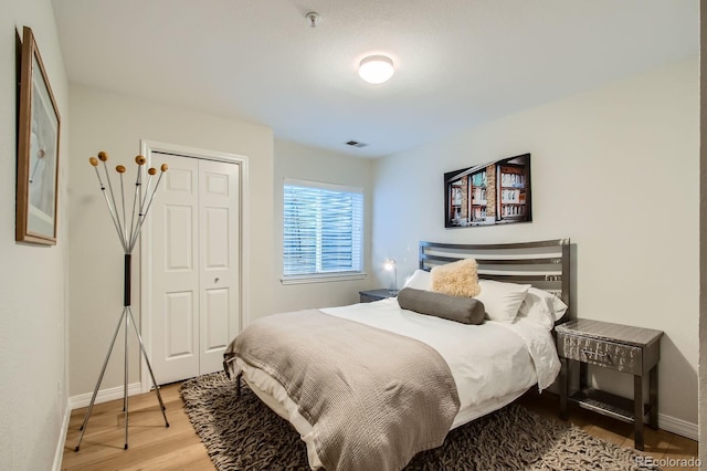 3228 47th, Boulder, CO 80301 - bedroom with baseboards, light wood-style floors, and a closet