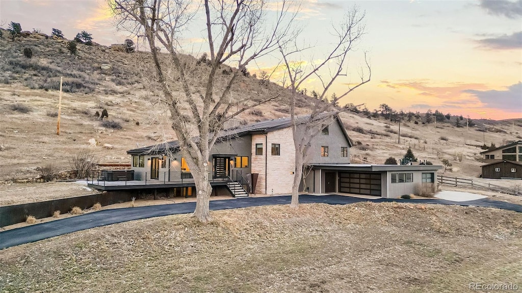 view of front of home with a mountain view and a carport