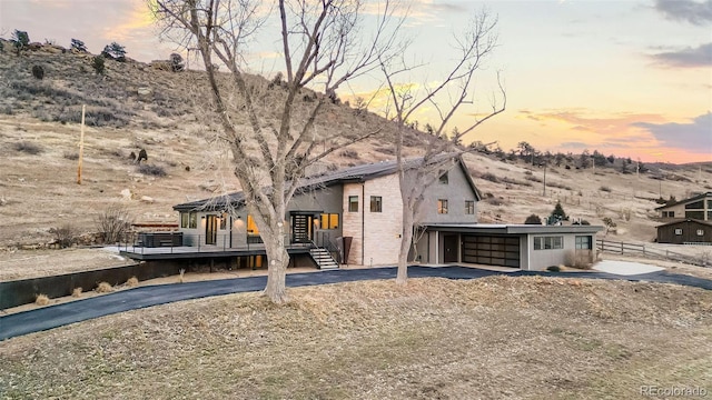 view of front of home with a mountain view and a carport