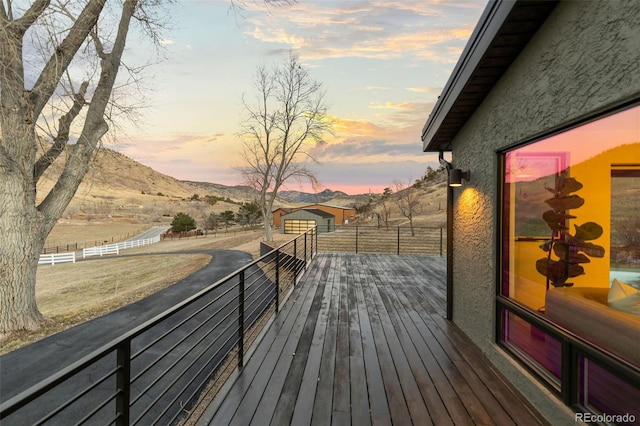 deck at dusk with a mountain view