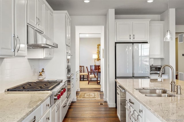 kitchen featuring dark wood-type flooring, white cabinetry, stainless steel appliances, and a sink