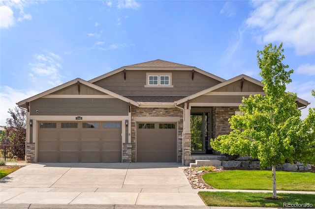 7965 S Vandriver Way, Aurora, CO 80016 - craftsman-style home featuring driveway, a garage, and stone siding