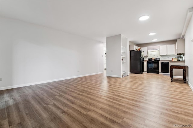 unfurnished living room with light hardwood / wood-style floors