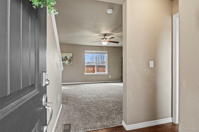 9840 Castor Dr, Colorado Springs, CO 80925 - carpeted entryway with baseboards, visible vents, and ceiling fan